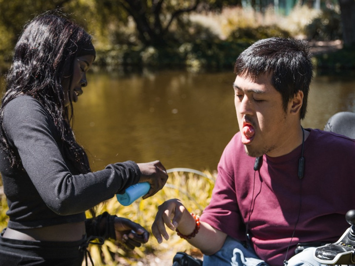 A support worker assisting a participant at home