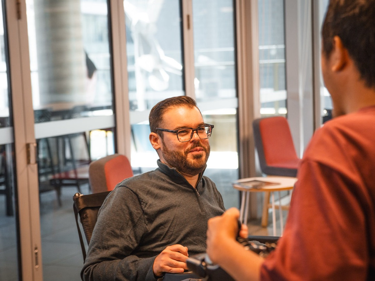 A participant being supported with learning and education