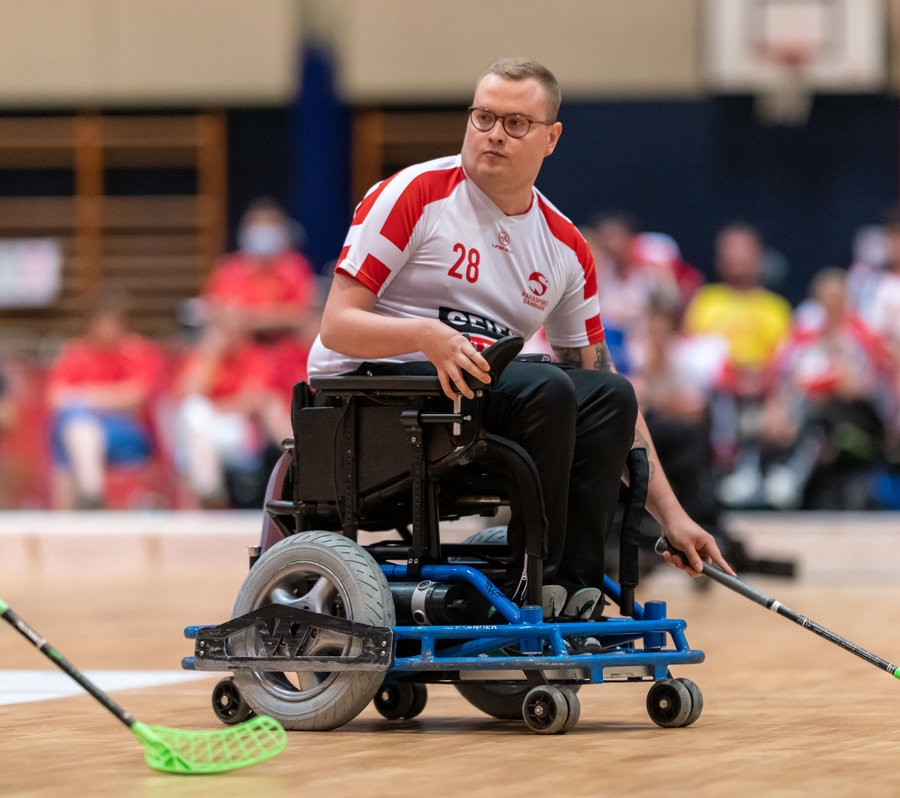 Powerchair hockey player on court